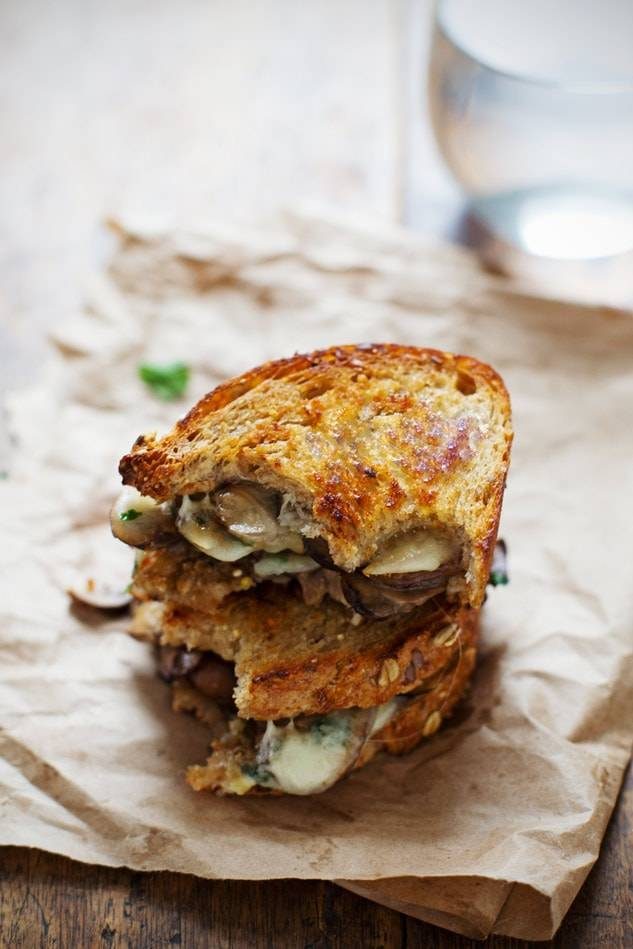 Garlic Butter Mushroom and Provolone Melts on paper.