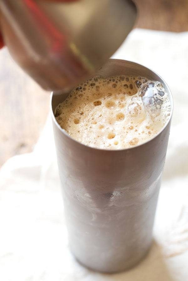 Iced coffee in a steel container.