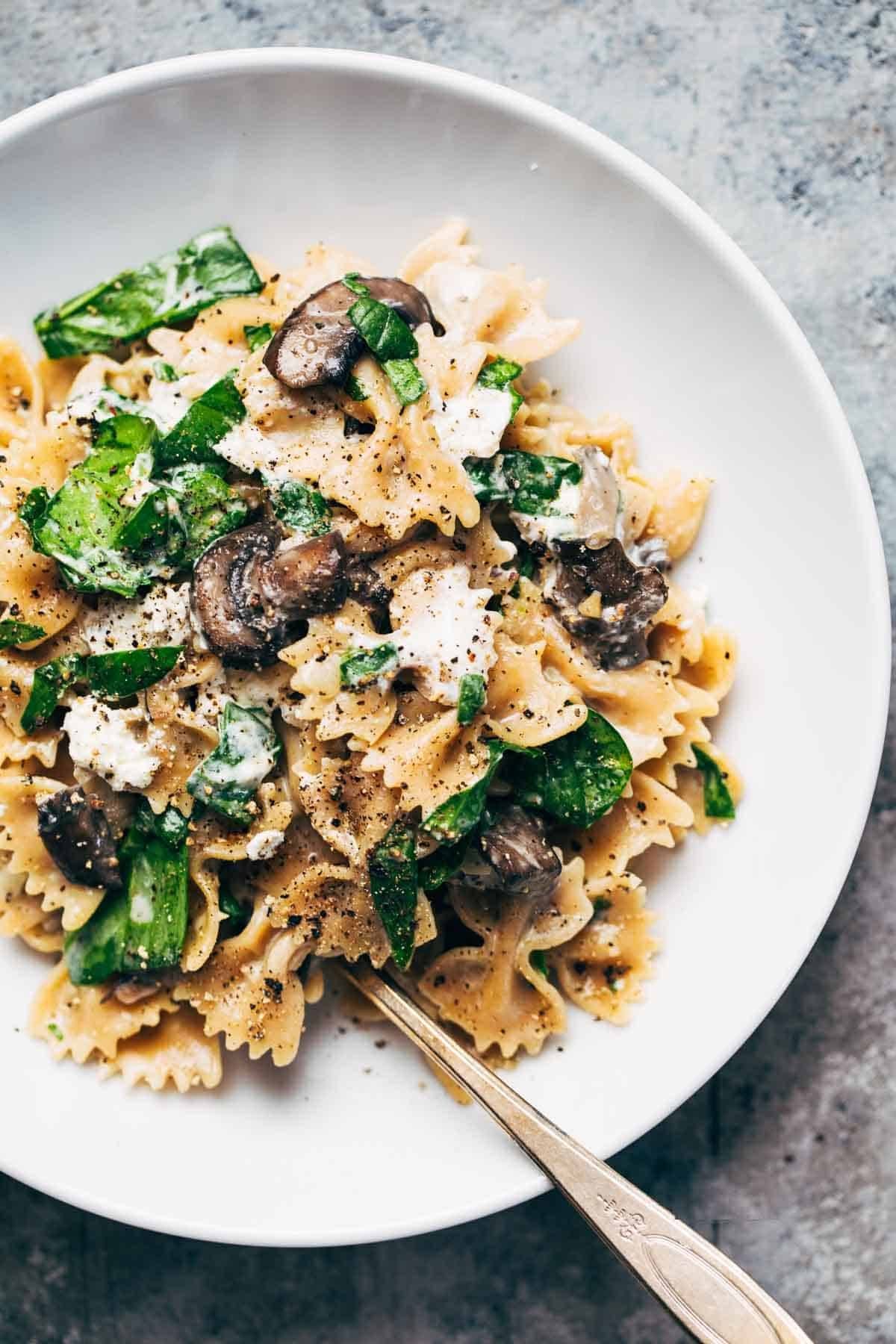 Mushroom Pasta with Goat Cheese in a bowl with a fork.